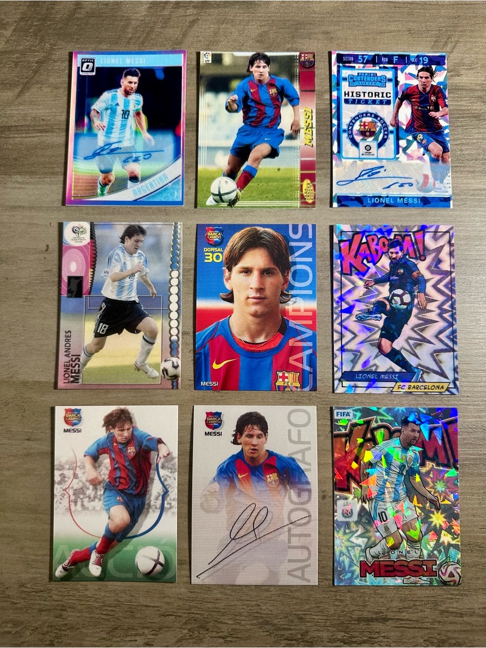 Lionel Messi Signed Rookie Lot of (9) Panini Mega Cracks Kaboom Novelty Cards.